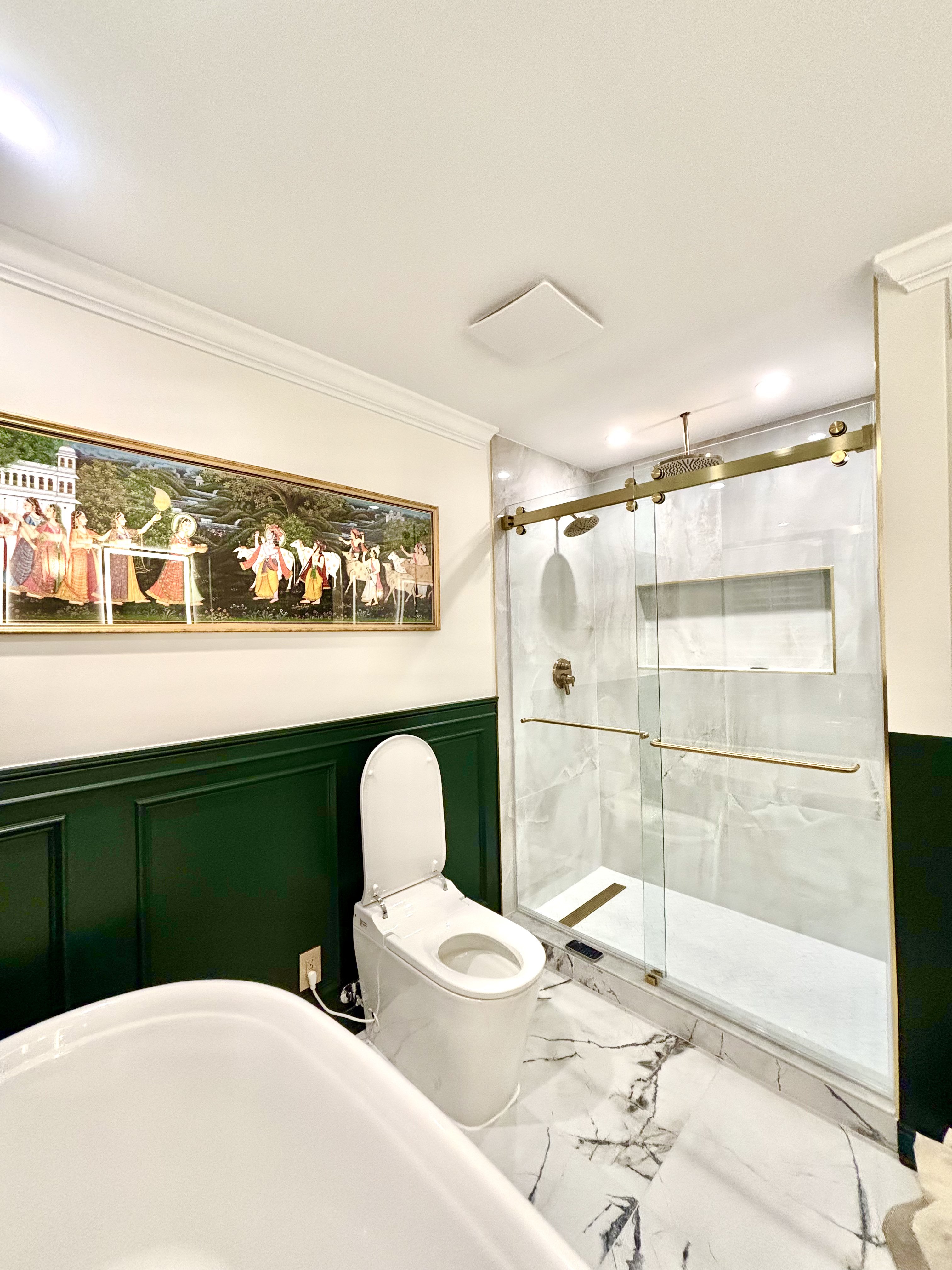 Smart toilet and glass walk-in shower with gold sliding door, alternate angle