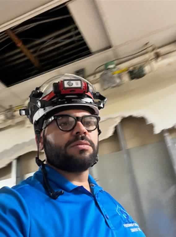Luis Peregrina, owner of Peregrina Plumbing Company, on a plumbing repair walkthrough in Alexandria, VA